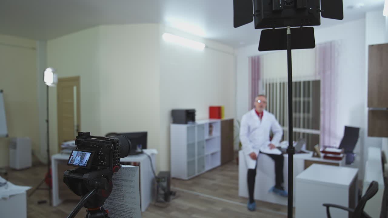 Remote online medical chat consultation. Professional online doctor looking at camera consulting patient in virtual chat