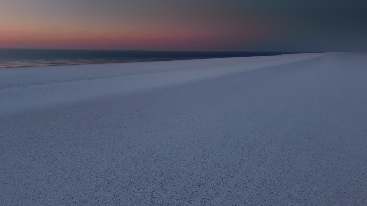 Capture a striking aerial view of cracking ice flows at the North Pole in 4K, highlighting the urgent climate emergency and the rapid melting of polar ice.