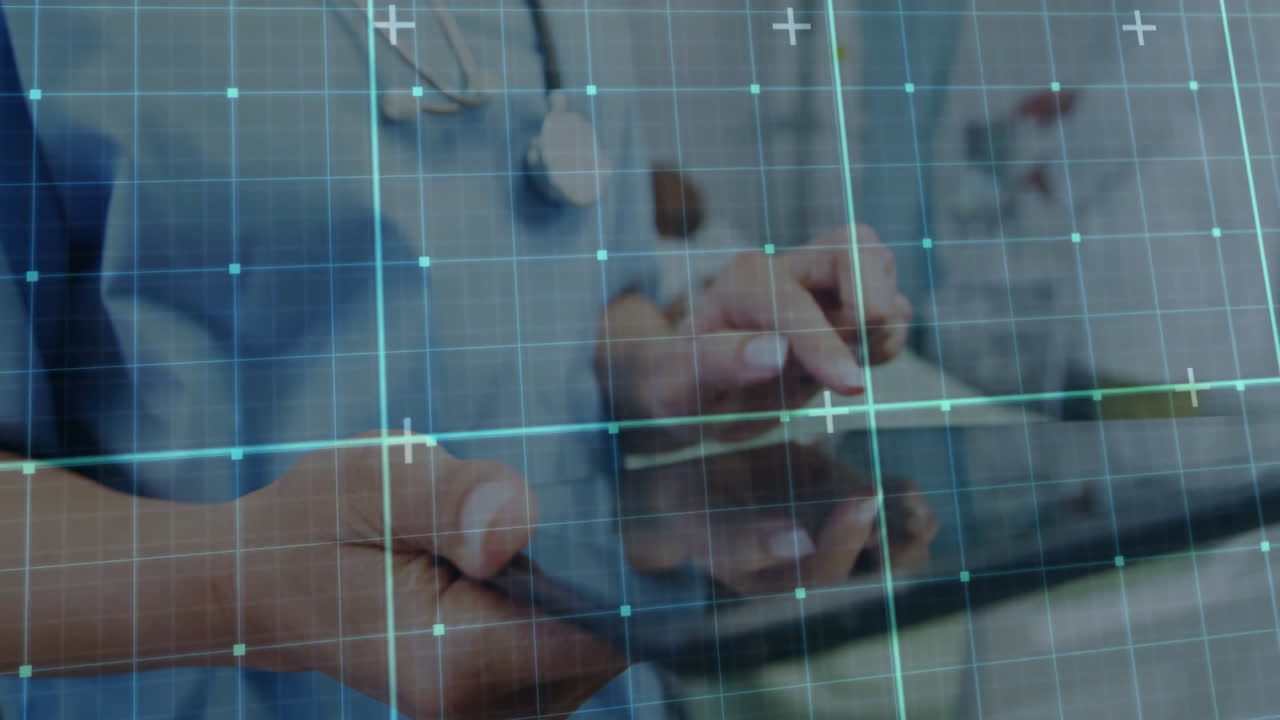 Three doctors discussing patient data around tablet in medical clinic, with grid and plus graphics