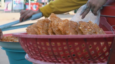 selling shrimp cakes at the side of the road