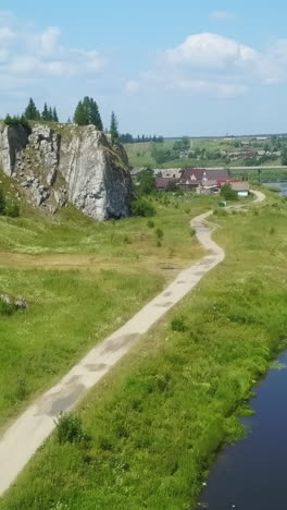 rural landscape with cliff and village