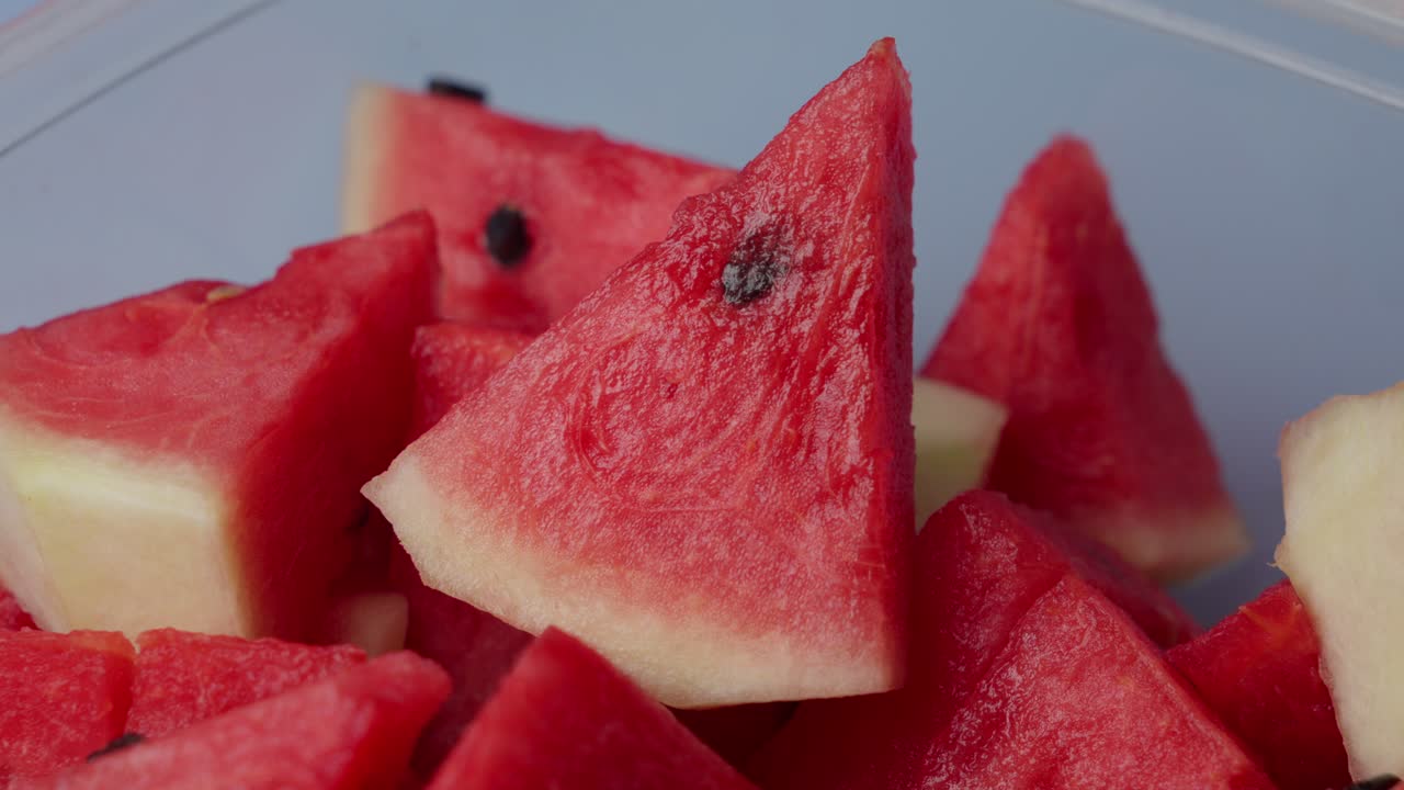 Metal Fork Stabbing A Juicy Red Watermelon, Close-Up Shot.