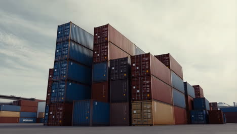 stacked shipping containers in a port or industrial area