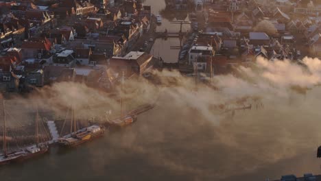 Aerial-telephoto-shot-of-Makkum-town-Friesland-during-winter-morning