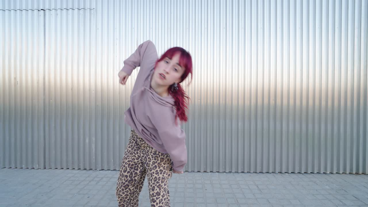 Young urban dancer performing energetic street dance routine