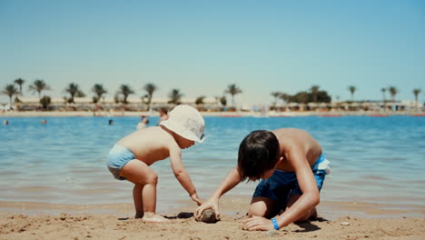 Adorable-children-having-fun-at-beautiful-coastline-in-summer-holiday.