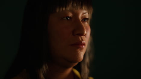 adult mexican lady portrait in the dark