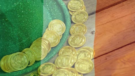 gold coins and green hat on a table with an irish flag on the foreground