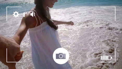 tomando fotos de una pareja con una cámara digital