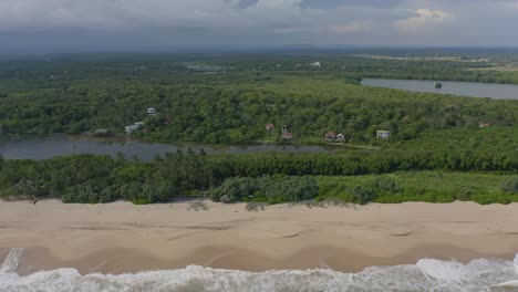 aerial of pristine tangalle beach with waves on tropical coast of sri lanka