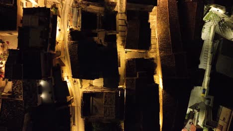 Aerial-top-down-view-of-Modica-Alta-Val-di-Noto-Sicily-Old-Baroque-Town-Rooftops-Southern-Italy-at-Night