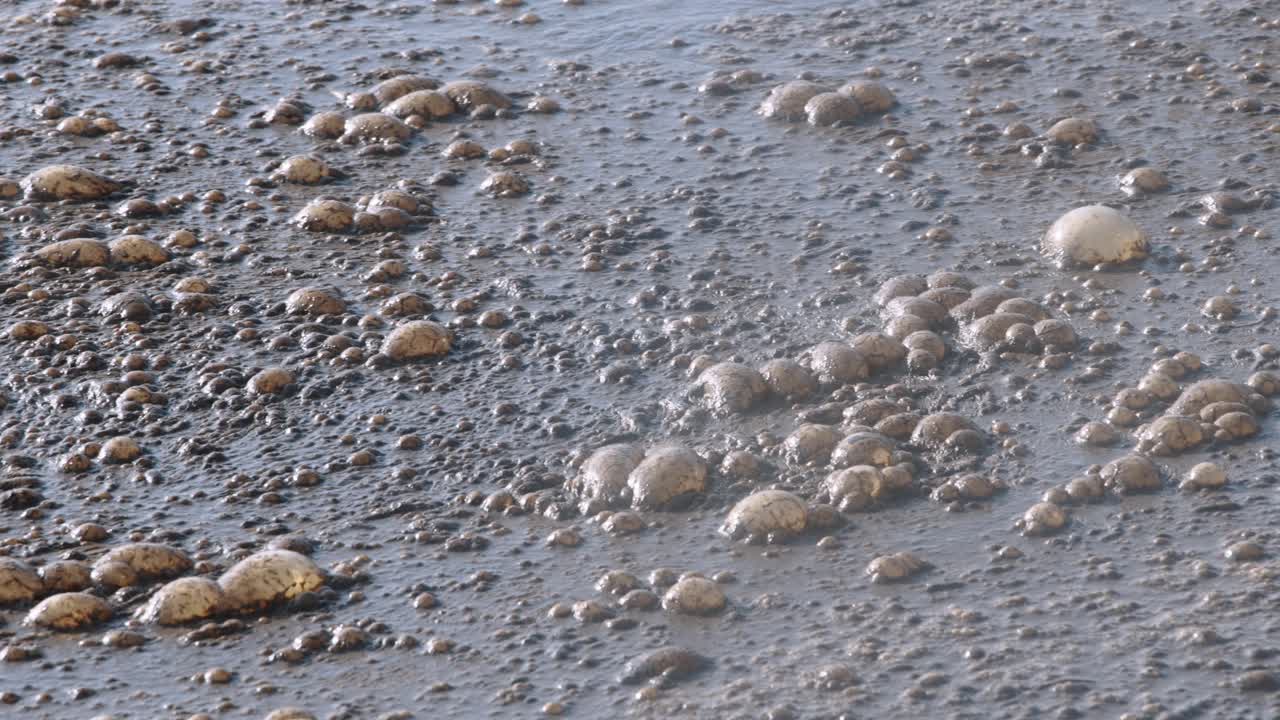 Surface wastewater with bubbles, symbolizing purification, dominant gray tone.