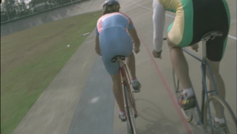 bicyclists compete on a circuit track 2