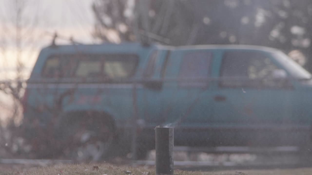 A Christmas ginger bread and graham cracker decoration has a large fire cracker or M 80 lit below it as it burns if finally explodes in slow motion!