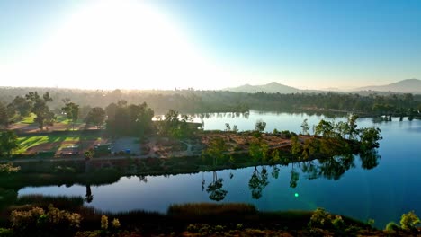 Emerging-above-Lake-Murray-island-park-San-Diego-aerial