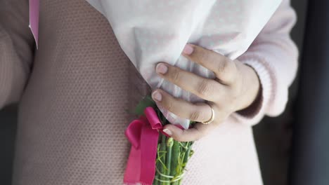 woman holding a bouquet of flowers