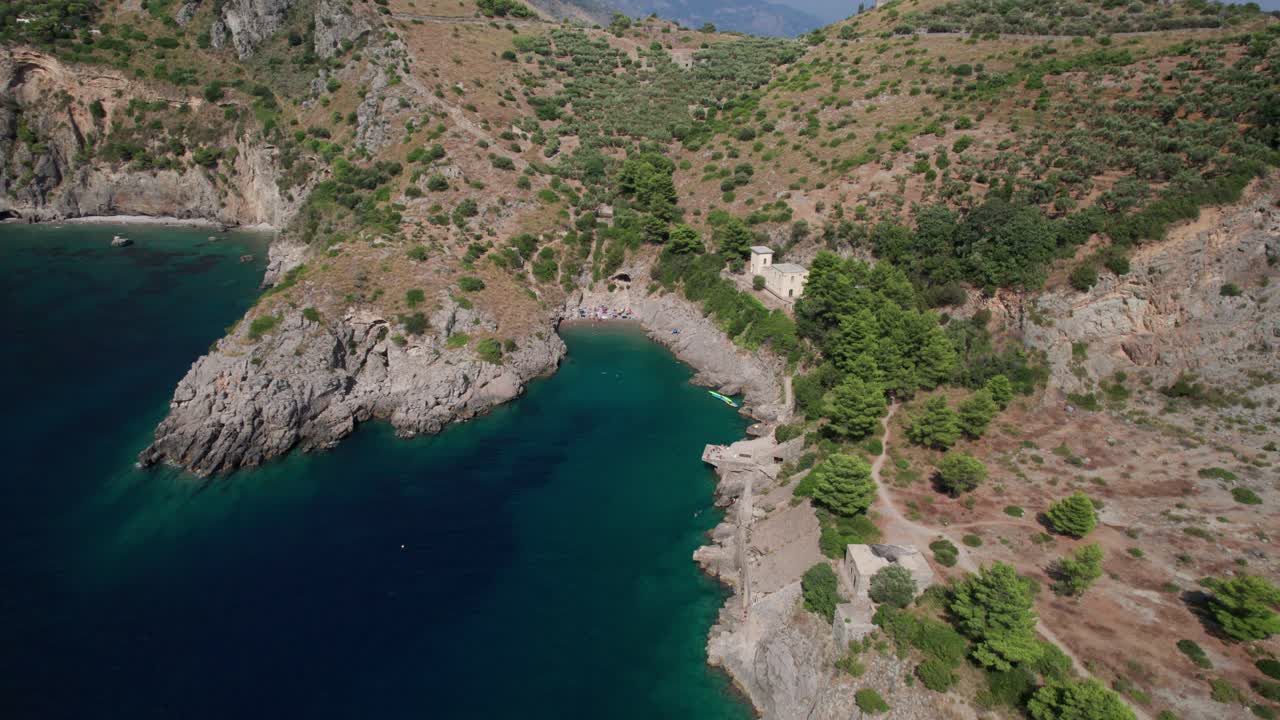 Aerial backwards view from ieranto bay to Salerno gulf. Italy. Zoom out effect.