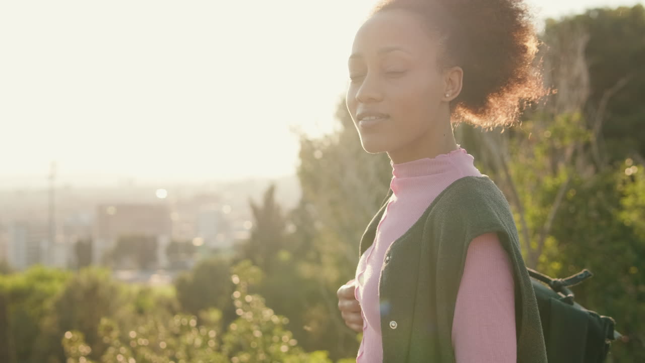 Young Woman Looking at City View at Sunset