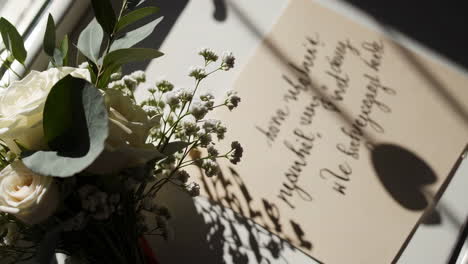 elegant floral arrangement with calligraphy card
