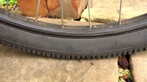 medium mountain bike tyre going flat, close up