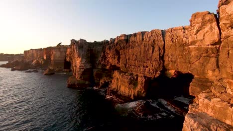 A-pan-of-Boca-do-Inferno-at-sunset-near-Cascais-Portugal