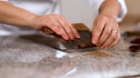 womsn chef making chocolate ganache