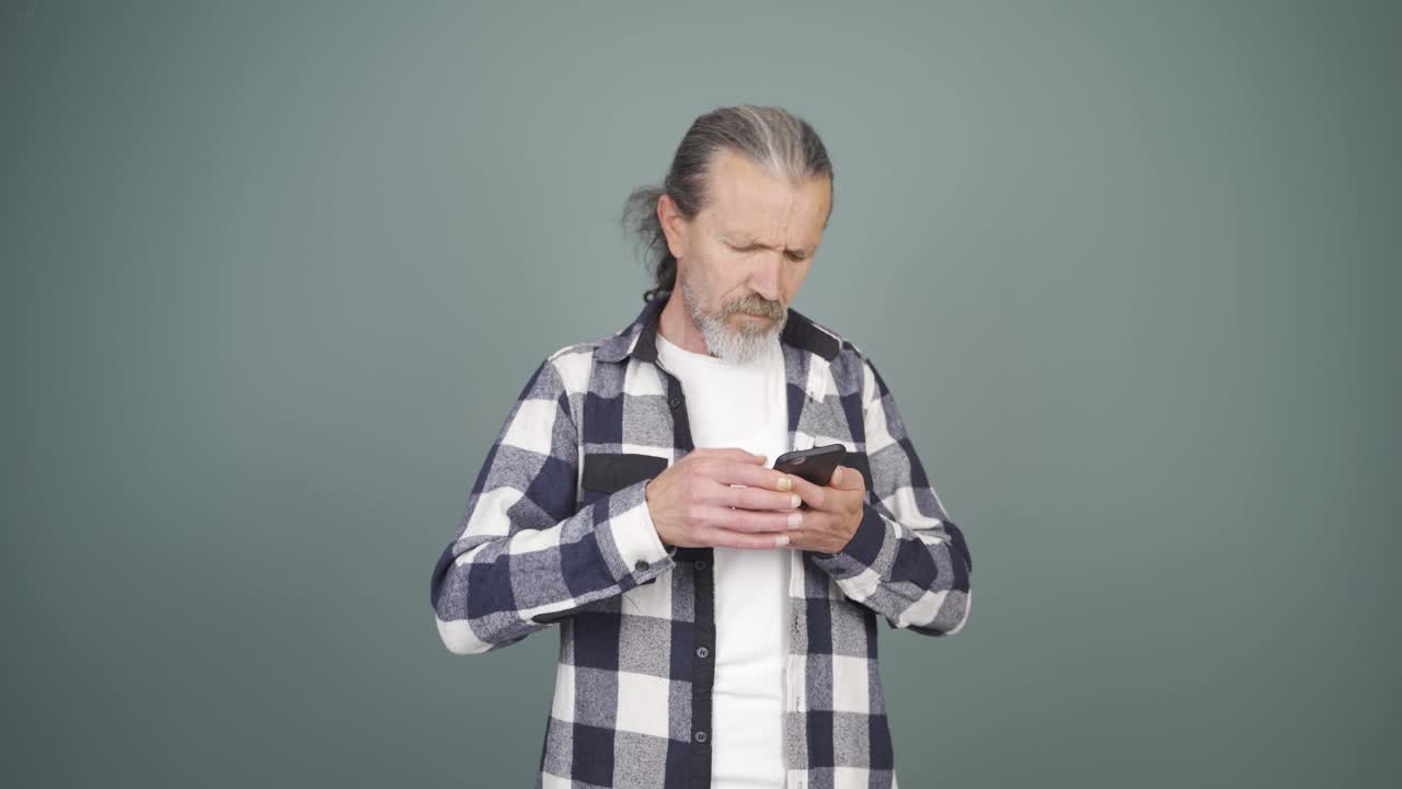 The man who can't use the app on the phone.