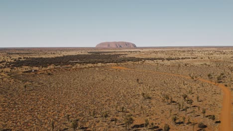 tracking drone shot of uluru in northern territory australia