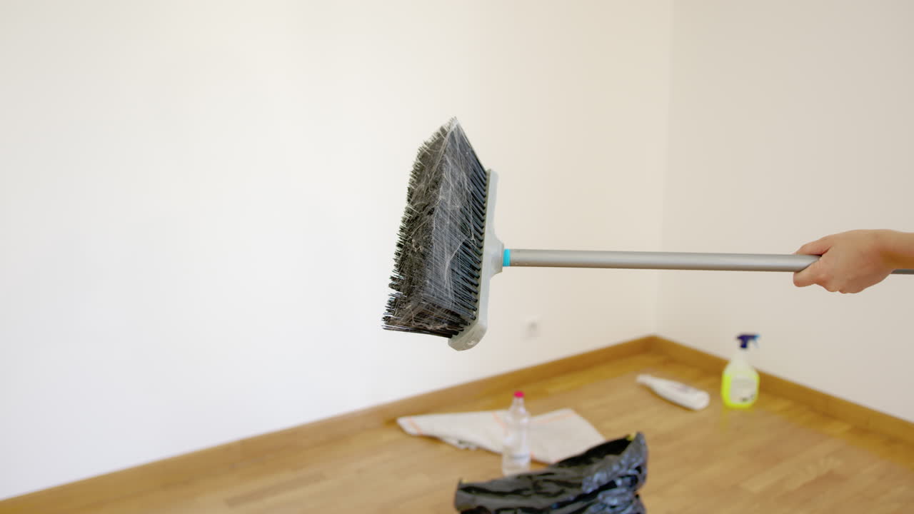 Dusty broom after cleaning new apartment