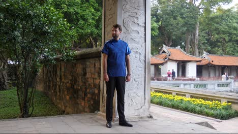 Male-model-standing,-moving-and-posing-for-out-of-frame-photographer