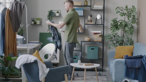 man doing laundry at home
