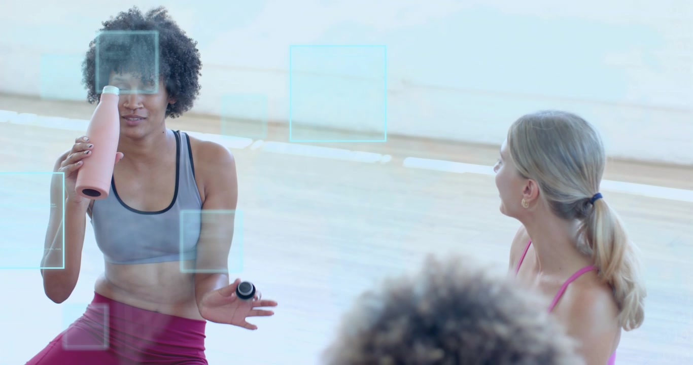 Curly-haired instructor twisting cap and sipping water activating animated fitness hydration panels