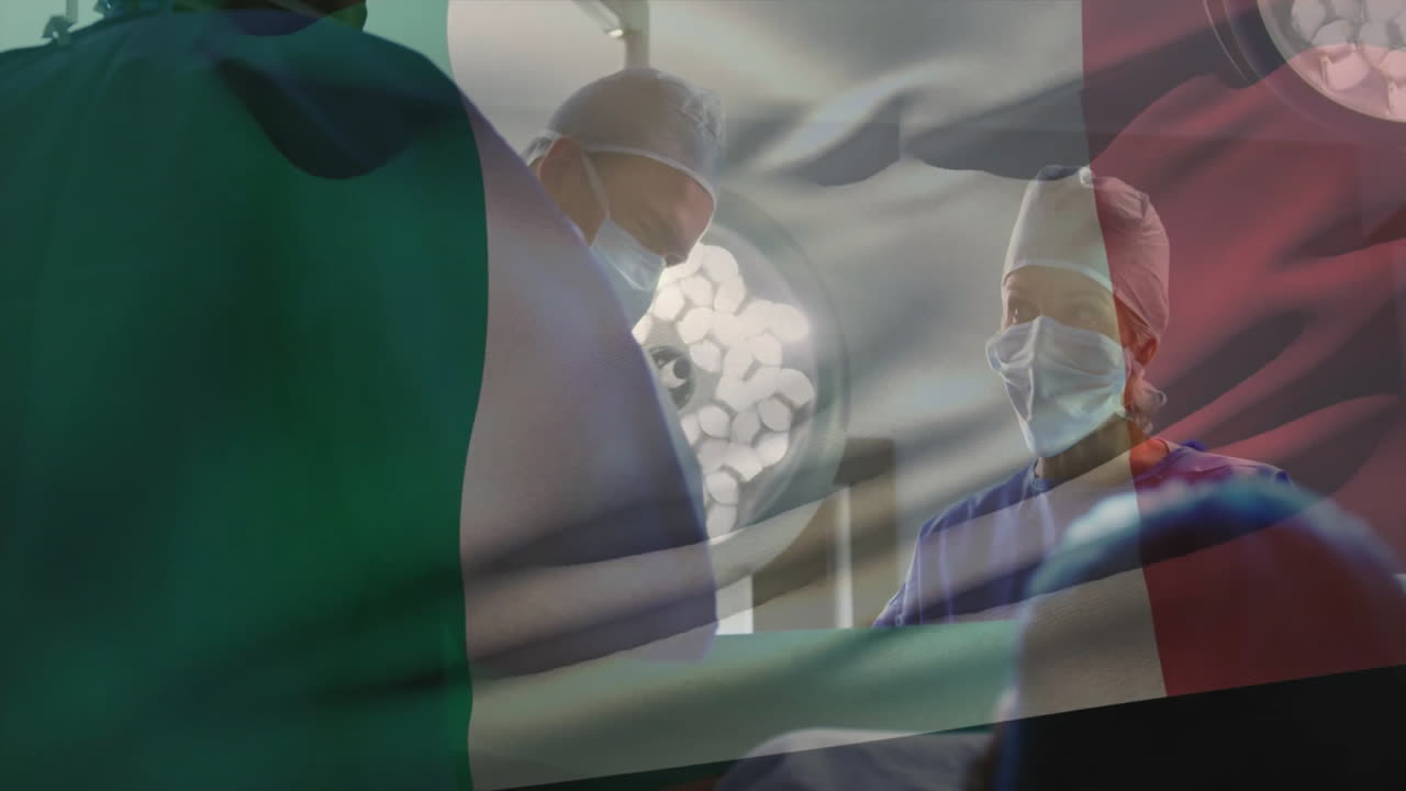 Surgical team performing operation in hospital operating room, showing animated vital signs graphs