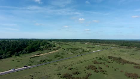 Beautiful-drone-shot-rising-over-an-English-countryside-landscape-in-summer