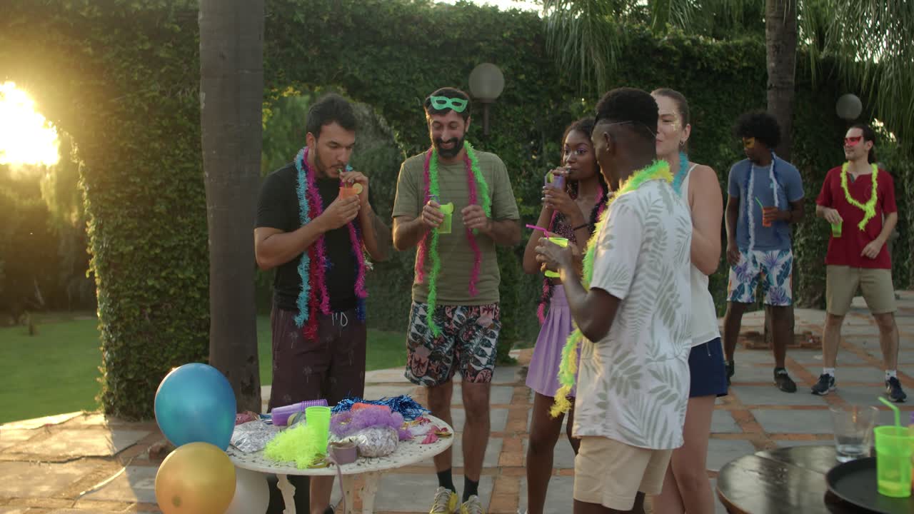 Friends enjoying a vibrant outdoor party during golden hour