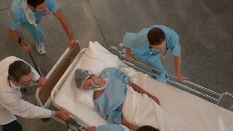 medical team carrying a patient to intensive care unit