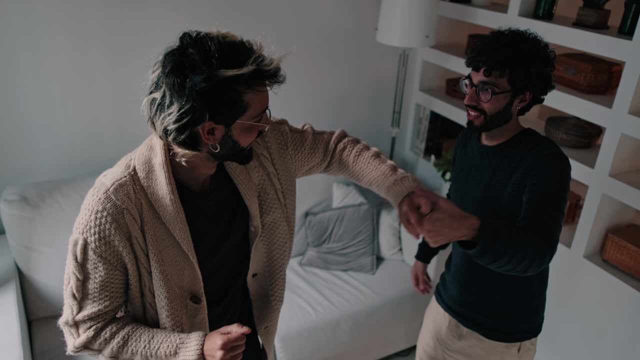 Gay Couple Dancing at Home Together