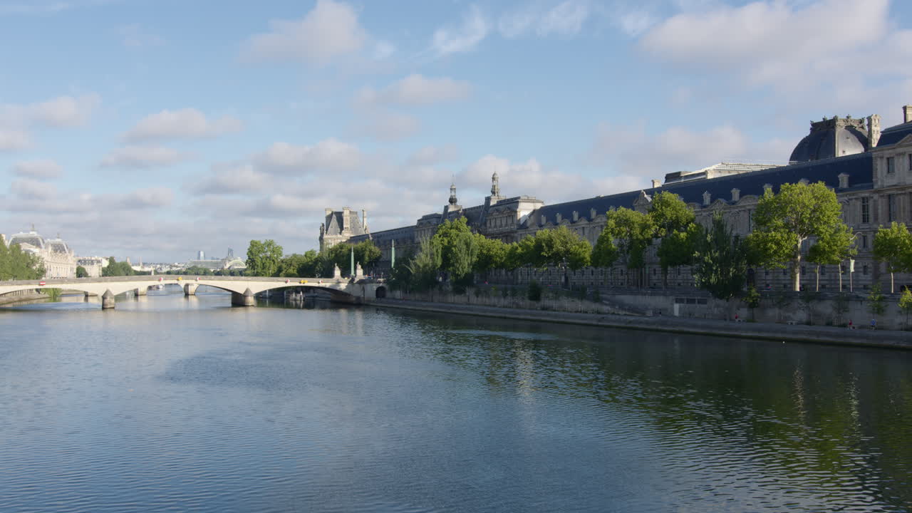View Of Pont des Arts In The Distance, Pedestrian Bridge Crossing The River Seine In Paris, France. Wide Shot