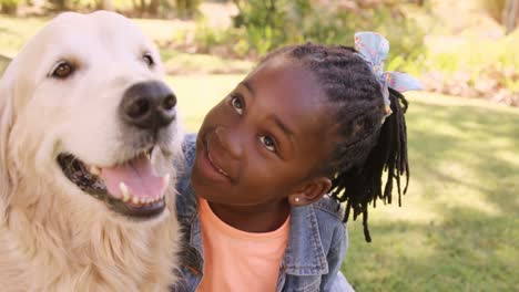 Portrait-of-cute-girl-is-petting-a-dog-