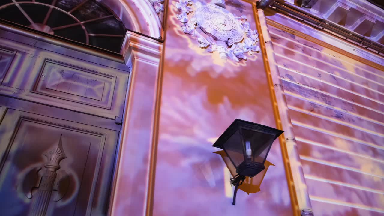 Colorful Light Projections on an Old Building at Night