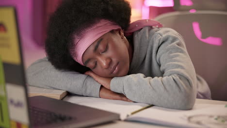 woman sleeping at desk