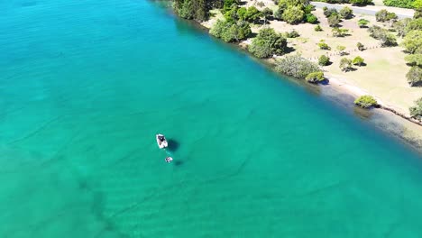 a boat travels along the scenic river