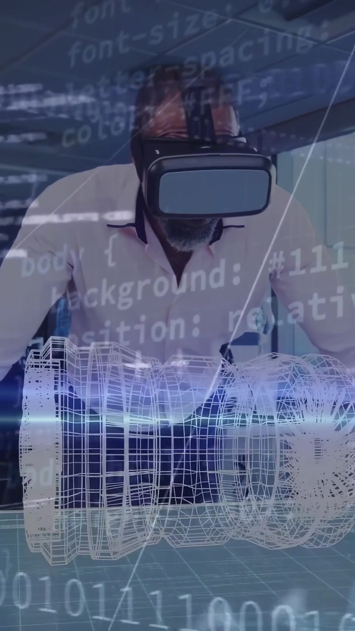 Vertical video: Engineer using VR, leaning at desk scanning rotating 3D model with code for design