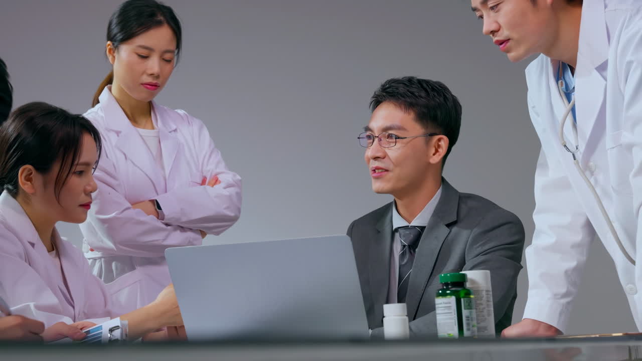 Medical team, pharmaceutical representative business agent discussing medication in hospital office