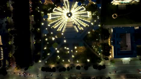 Illuminated-pyramid-of-Tirana-seen-from-above-at-night,-architecture-of-dictatorship-in-Albania-nowadays-a-high-tech-hub-for-young-people