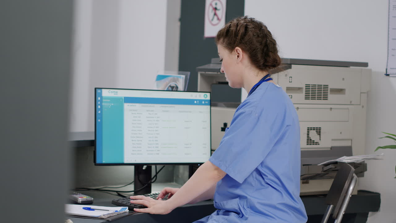 Medical office reception area with nurses and computer