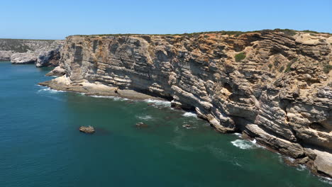 stunning seascape with rock cliff on sunny day