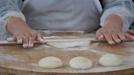 making dough with a rolling pin