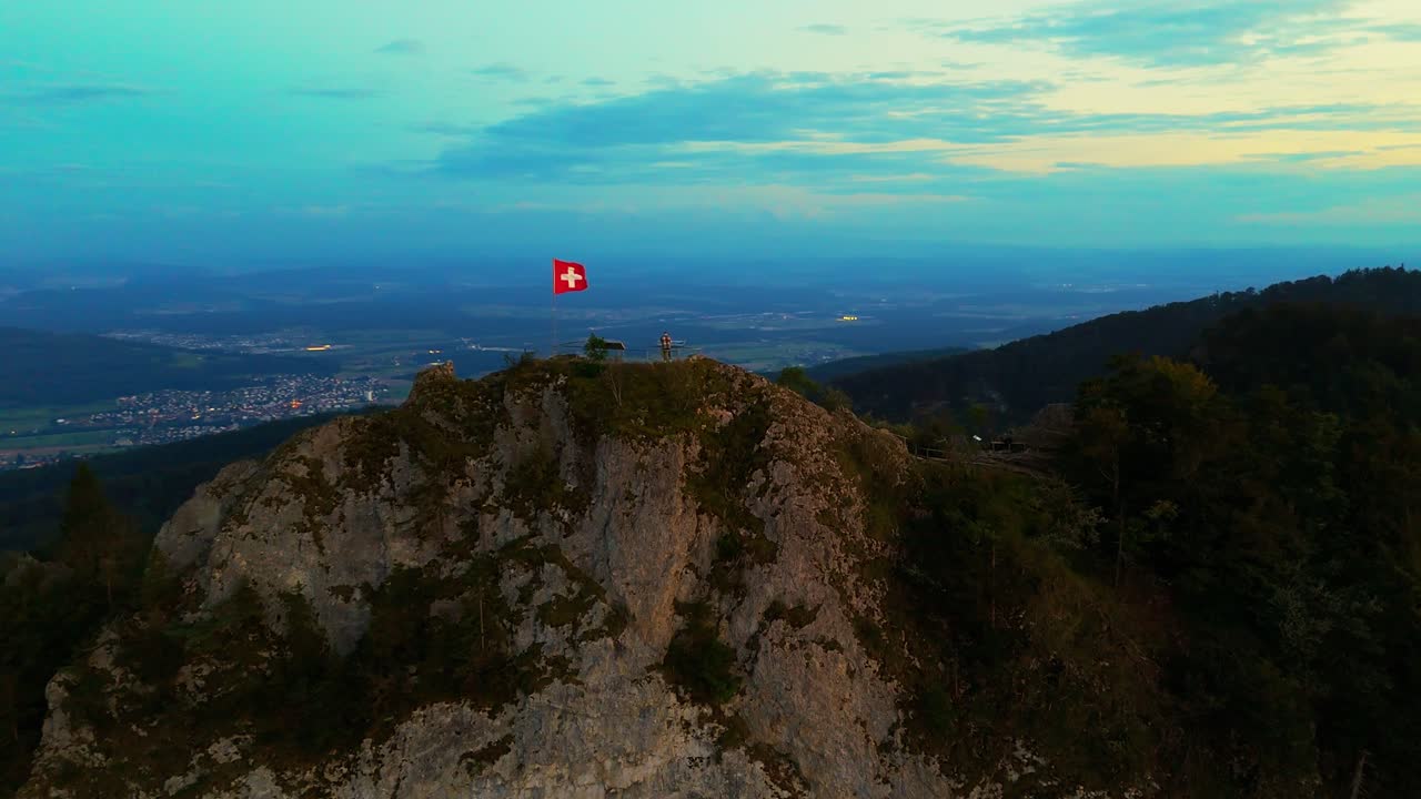 Swissflag in the wind on top of the Belchflue in Basel Switzerland
