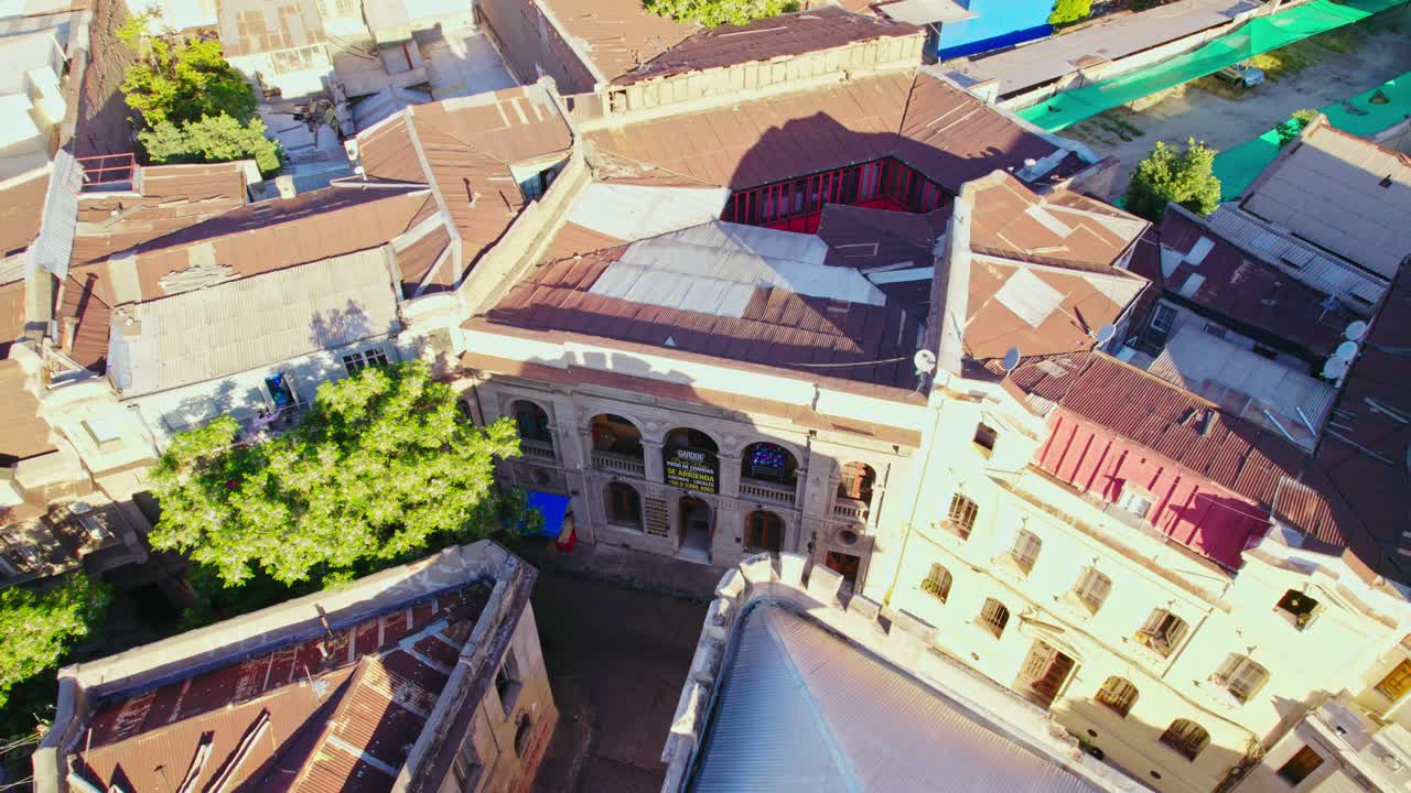 Bird's eye view dolly in of a housing complex in a single structure, old architecture in the Concha y Toro neighborhood